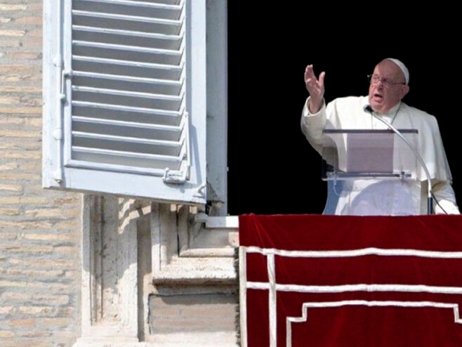 Pope Francis addresses the crowd from the window of the apostolic palace overlooking St. Peter's square during the Angelus prayer on October 27, 2024 in The Vatican.